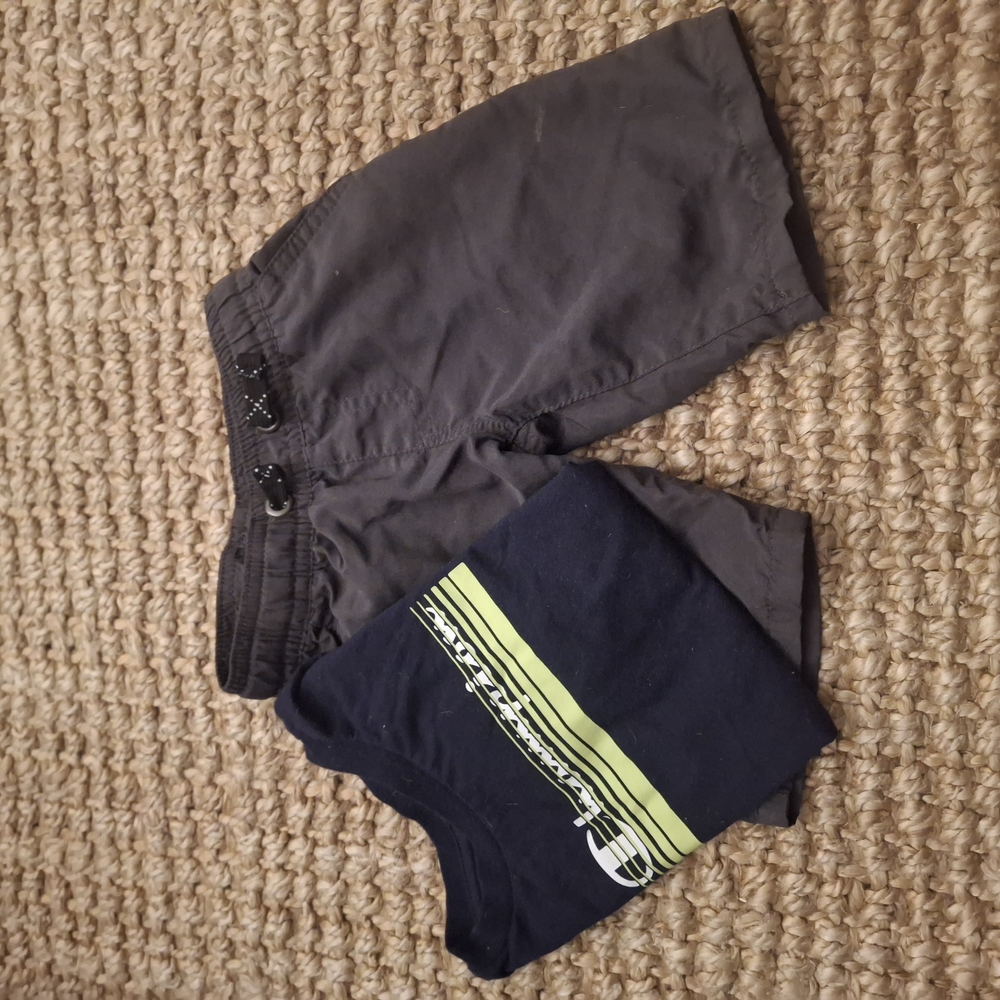 Toddler 2T Champion shirt with grey shorts.